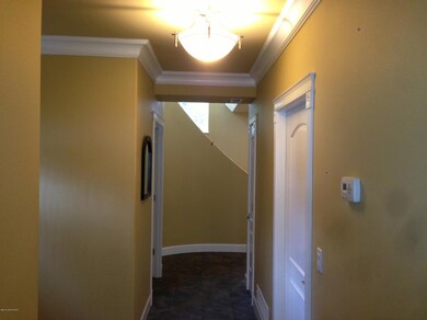Crown moulding, wide hallway, tall ceili