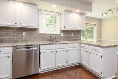 New granite countertops, tilebacksplash, light fix