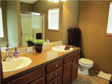 Master bathroom with tall vanity and two sinks