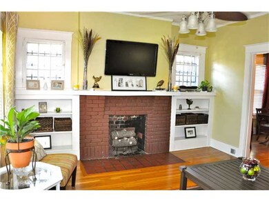 This cozy Living Room boasts gleaming hardwood flo