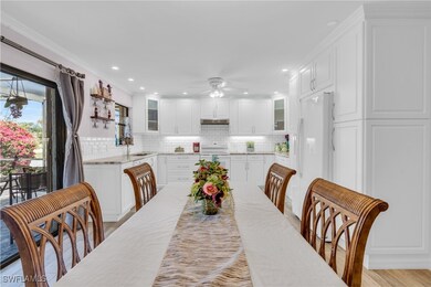 Dining space with a ceiling fan, recessed lighting
