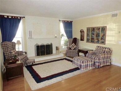 Lower unit living room area with fireplace & wood 