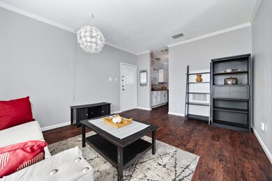 Living area with visible vents, an inviting chand