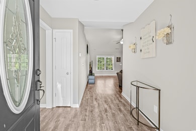 Entrance foyer featuring wood finished floors and ceiling fan