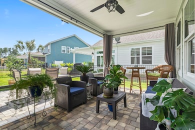 View of patio with a ceiling fan