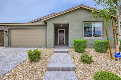 View of front of house featuring stucco siding, an