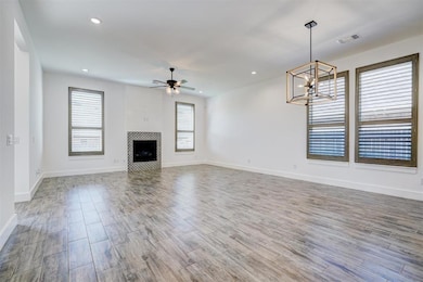 Unfurnished living room featuring hardwood / wood-