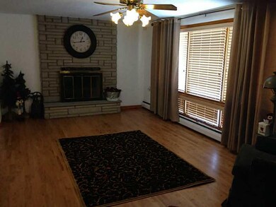 Living Room. Beautiful Hardwood floors,brick wood 