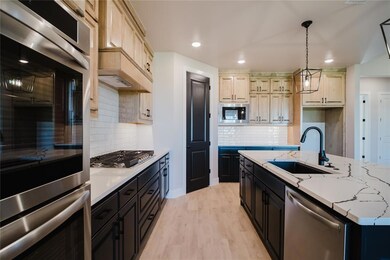 Kitchen featuring pendant lighting, sink, decorati