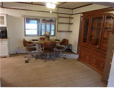 Dining Room. Open dining area with hutch