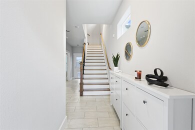 Charming entryway sets the tone for a home designed with both style and function.