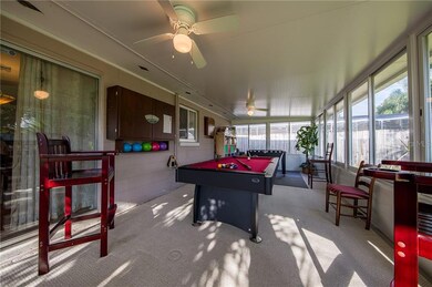 Entertain friends and family and enjoy the FULLY SCREENED and SLIDING GLASS WINDOWS surrounding this 4-season BONUS ROOM.