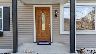 View of exterior entry with a porch