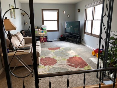 OPEN WROUGHT IRON STAIRCASE TO FOYER AND LOWER LEV