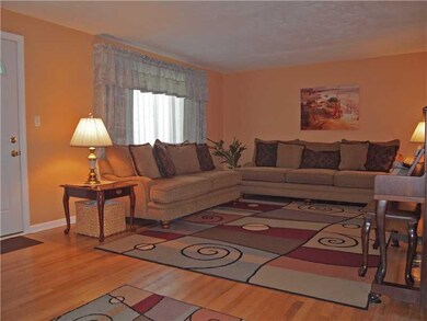 Living Room. Oversized room has hardwood floors. N