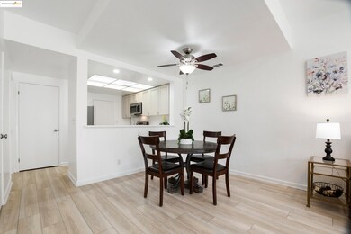 Dining space featuring light wood-style flooring, ceiling fan, and recessed lighting