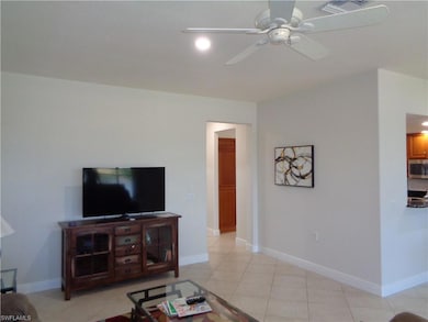 Tiled living room with ceiling fan