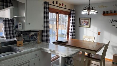Dining area with patio doors to the deck and rear 