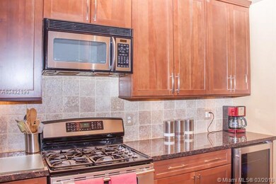 Kitchen is beautiful! Extra Tall Wood Cabinets. Granite Counter Tops. Full backsplash. Stainless Steel appliances. Gas Stove.