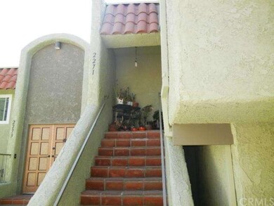 Inviting stairway features sautillo tile and a ple