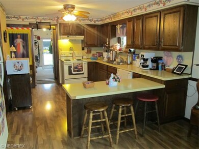 Open kitchen with pantry and breakfast bar