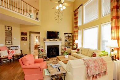 Enjoy the natural light and high ceilings in this bright and airy living room!