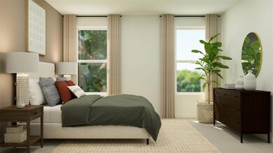 Bedroom featuring light carpet