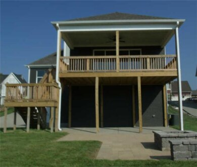 Rear view of covered deck, covered patio and firep