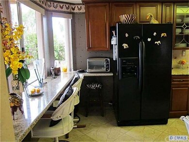 Kitchen bar area with view to backyard...refrigera