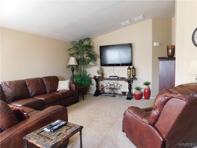 Carpeted living room with TV