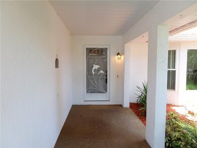 Covered walkway to front door with pebble, non-ski