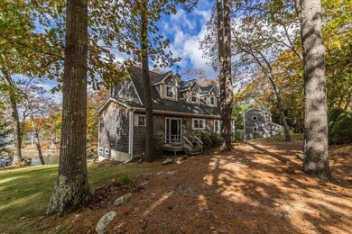 The main house with cottage in...