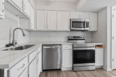Kitchen with appliances with stainless steel finis