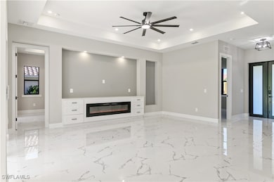 Unfurnished living room featuring visible vents, r