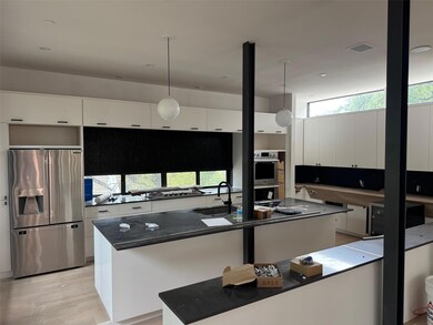 Kitchen featuring stainless steel appliances, whi