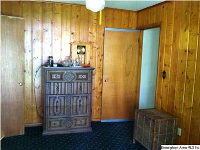 Third bedroom is paneled and opens to deck.