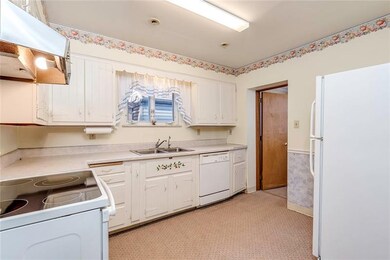 The kitchen is has a connected 1/2 bath with laund
