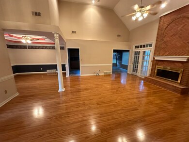 Unfurnished living room with wood-type flooring, h