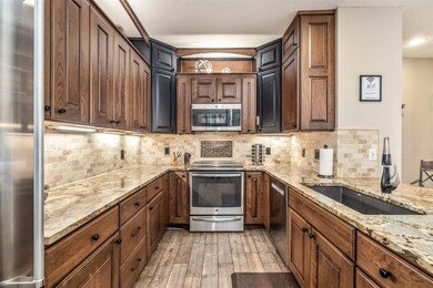 Kitchen featuring a sink, appliances with stainles