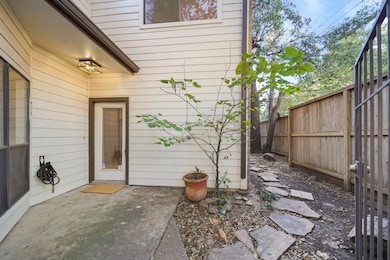 This cozy entryway is secured behind a gate with a