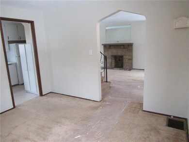 Dining room looking into the living room and kitch