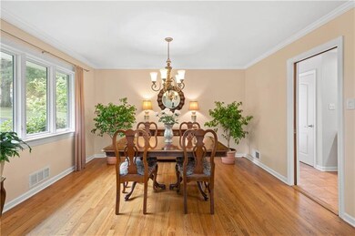 Open to both the living room & kitchen, a formal d