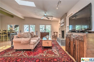 Beautiful living room with stone fireplace. Easy a