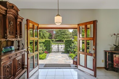 Custom doors open to spacious foyer