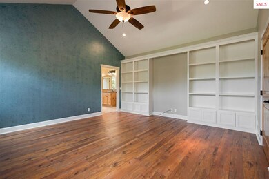 Custom built shelving in the Master