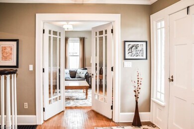 French doors lead from the inviting foyer to the l