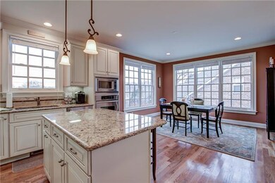 Kitchen opens to large dining rm with large windows were the light streams in.