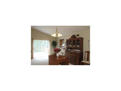 Dining Area. Glass sliders off dining room to larg