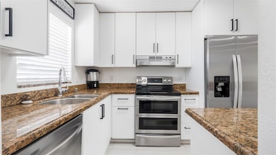 Beautifully remodeled kitchen with granite counters, SS Appliances, soft close cabinets +++