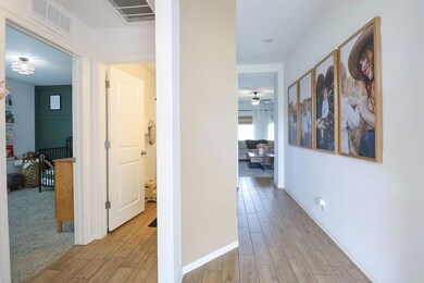 Hall featuring light wood-style floors and baseboards